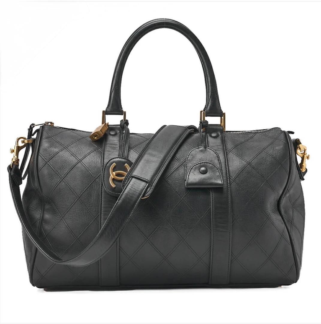 Sac Chanel Boston noir matelassé cuir agneau bandoulière 2WAY
